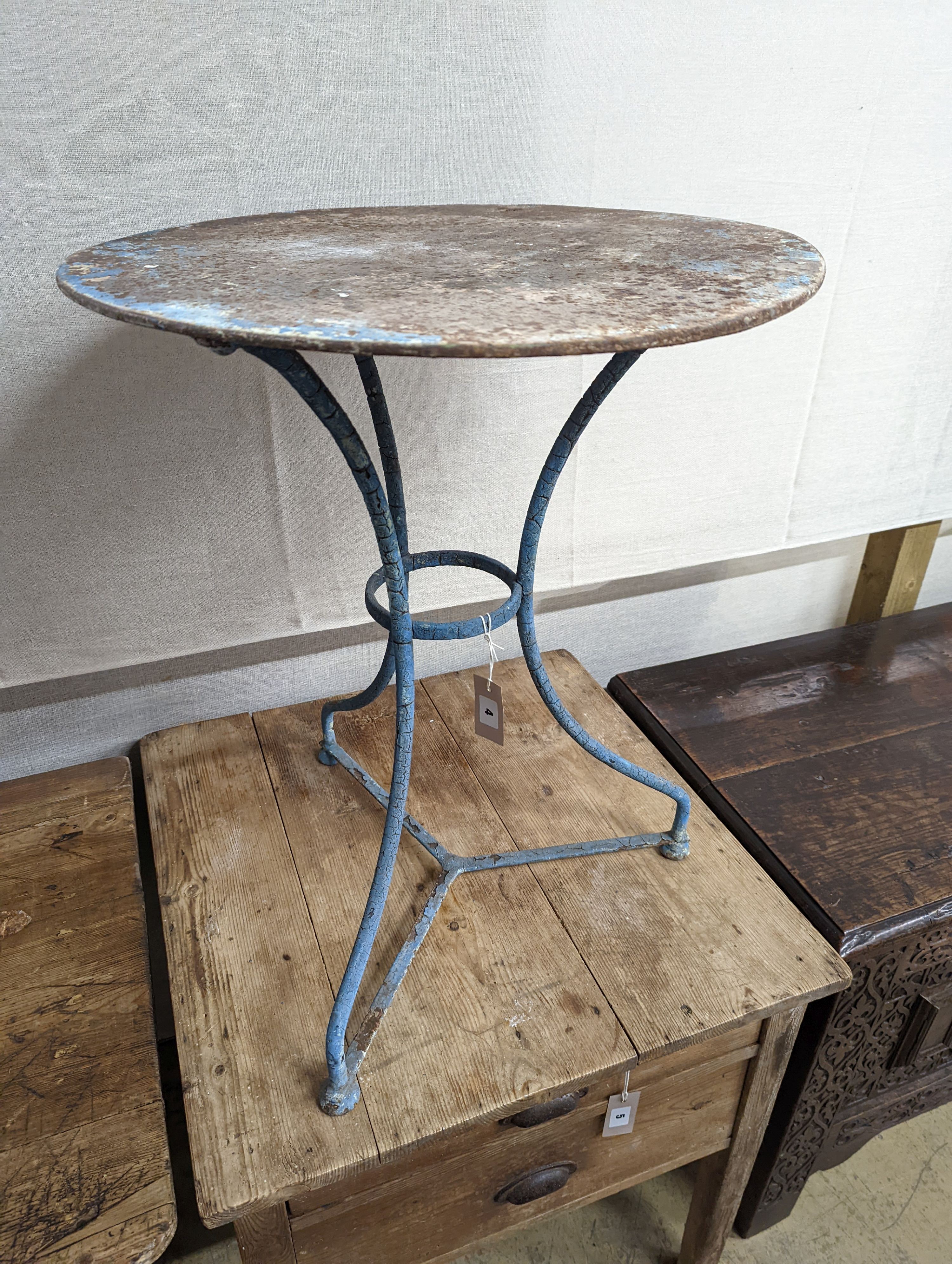 A French wrought iron garden table. W-55cm, D-55cm, H-69cm.